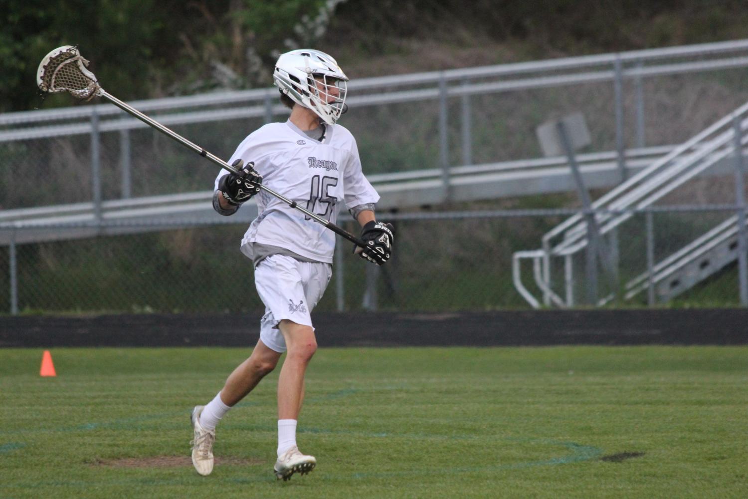 Sophomore Will Beauchamp runs down the field preparing to catch the ball. Reagan defeated West Forsyth with a score of 11-3. 