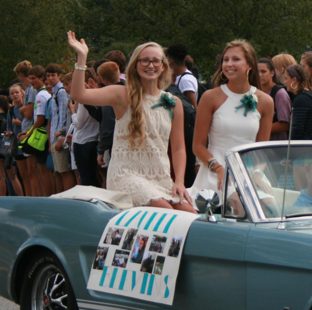 Seniors Hunter Beem and Lauren Blevins wave to classmates in the Homecoming Parade. The parade was on Friday Sept. 15.