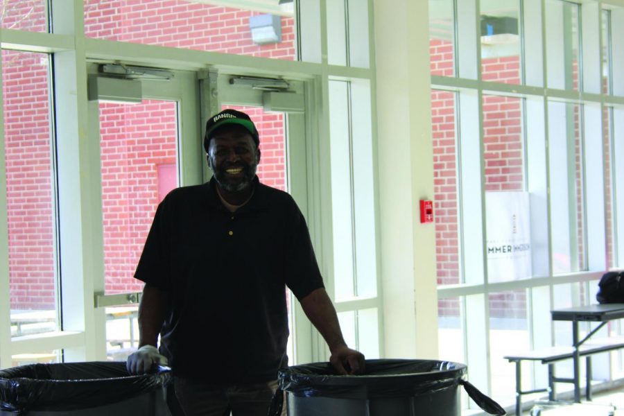 Richard Zeke Johnson showcases his well known smile at the end of the lunch period.  Johnson has worked at Reagan as head custodian for six years. 