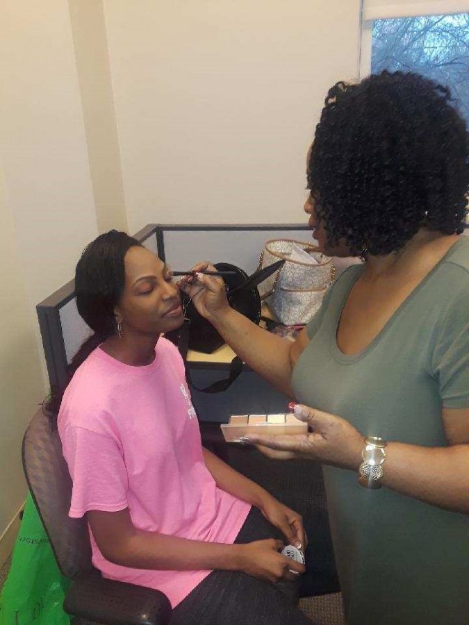 Sophomore Mauriah Turner gets makeup done by her aunt for the Miss Greensboro Pageant on Feb. 25. 