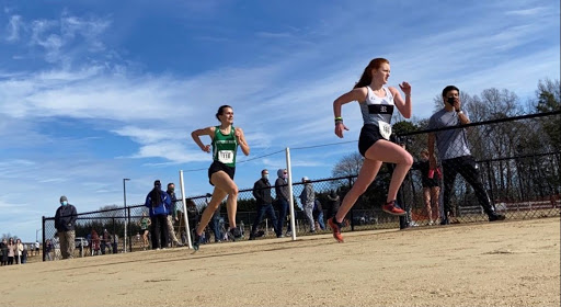 Junior Libby Marcantonio sprinting to the finish at the State Meet, where the girls team finished in 3rd.