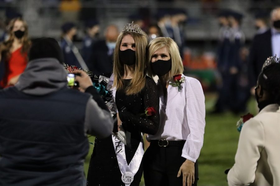 Senior Jordan Martin smiles proudly for a picture after being announced as Reagan’s 2021 homecoming queen. Jordan was escorted by her mom Emily Martin.
