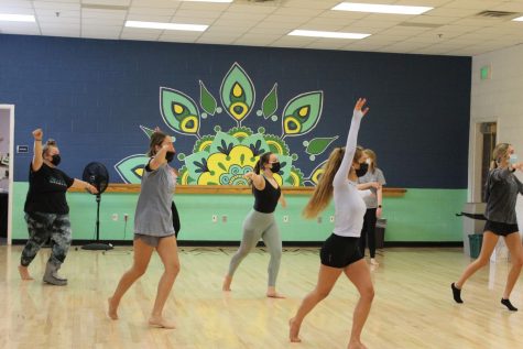 Students practice a routine in Molly Harwells Dance 3/4 class. All students and staff are required to wear masks while indoors per COVID-19 guidelines.