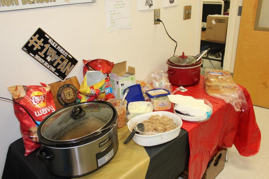 Crock-Pots and miscellaneous slaws and dips fill a table in the upstairs 400 teacher work room. Reagan staff has started a new tradition they are calling “Crock-Pot Fridays” that brings teachers out of their classrooms to enjoy a hearty lunch and laugh with their coworkers.  
