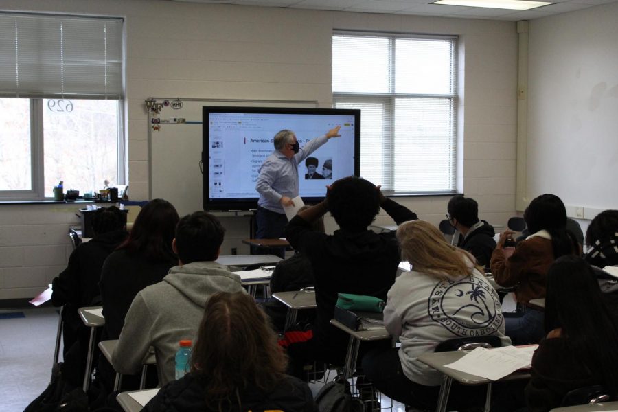 American+History+II+teacher+Scott+McAbee+utilizes+his+Promethean+board+to+teach+American-Soviet+relations+to+his+class.+McAbee+is+one+the+many+teachers+at+Reagan+who+have+redesigned+their+classroom+around+the+new+Promethean+boards.