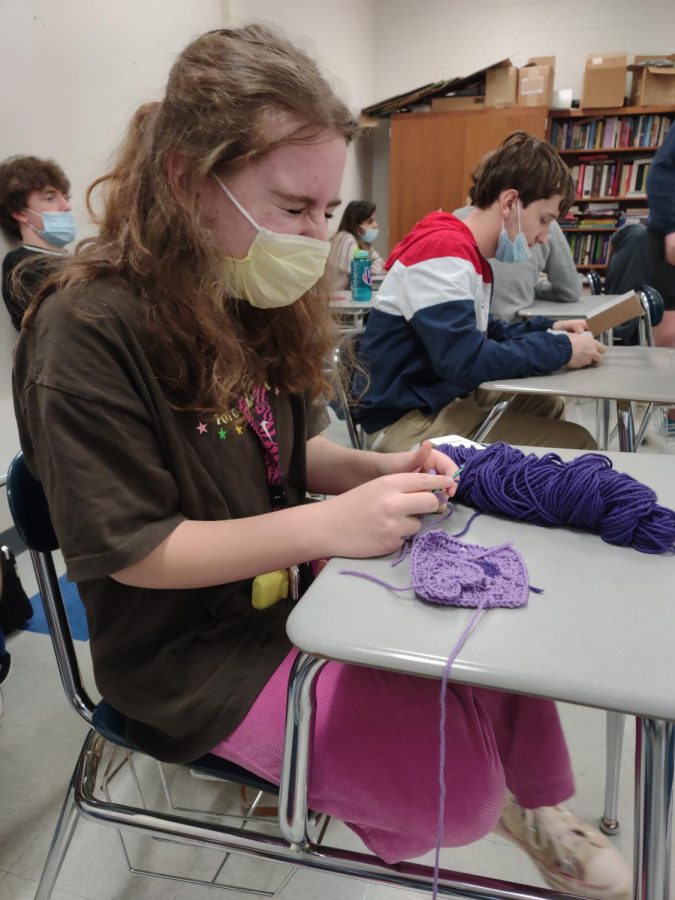 Junior Ayden Meyers begins to work on a new crochet project as class begins. Juggling homework and hobbies is a challenge for students who try to form a work-life balance.